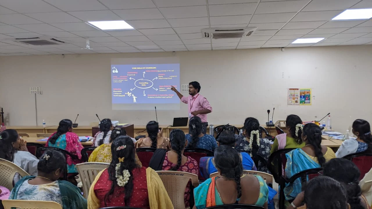 Athma facilitating an awareness session with a seated audience